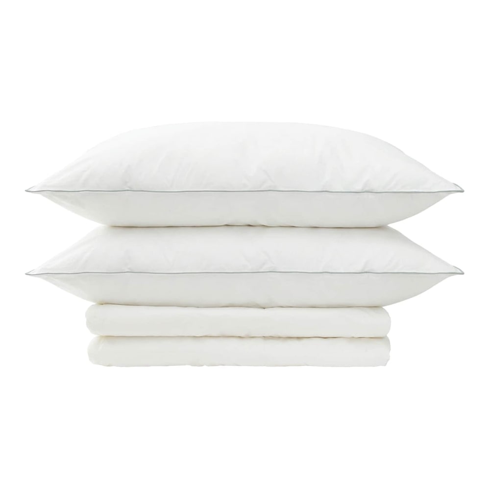 two pillows and a folded duvet on a white background