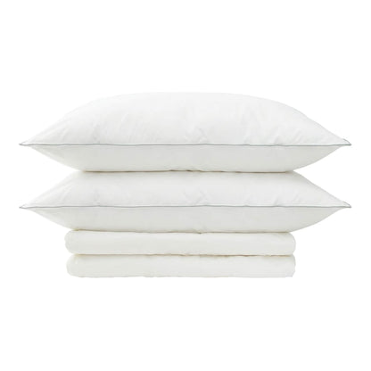 two pillows and a folded duvet on a white background