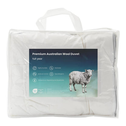 the wool duvet and pillow set inside a transparent storage bag with a product information label