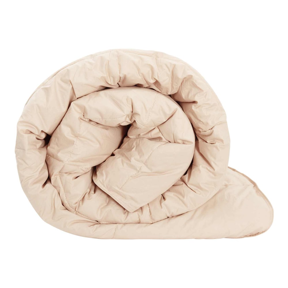 A beige winter duvet rolled up, showing its soft texture and quilted design