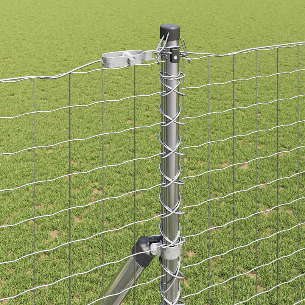 Close up of a fence post showing how the wire is attached and secured