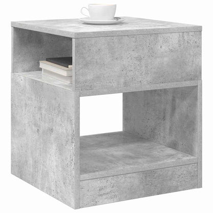 Concrete grey engineered wood end table with a cup and books on top