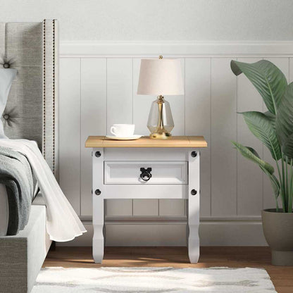 vidaXL End Table CORONA White Solid Pine Wood next to a bed with a lamp on top