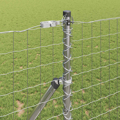 a close-up of the metal fence post with wire mesh attached and a diagonal support brace