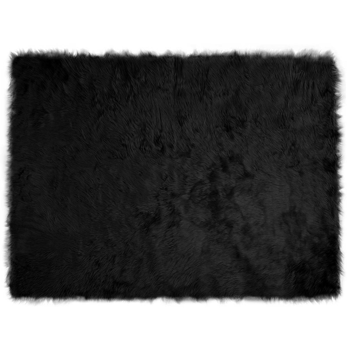 A plain black faux sheepskin rug with a shaggy texture