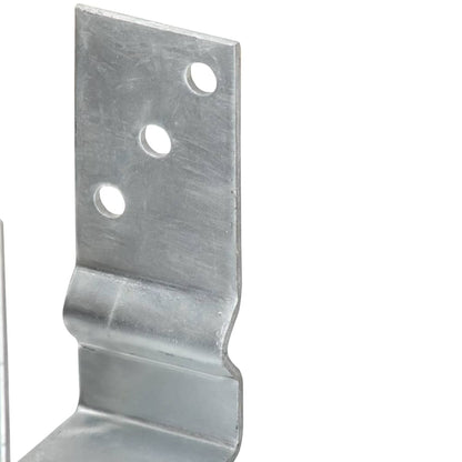 Close-up of the galvanised steel fence anchor showing fixing holes and curves