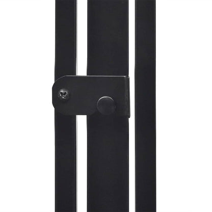 The black metal connector plate securing the vertical bars of the fireplace screen