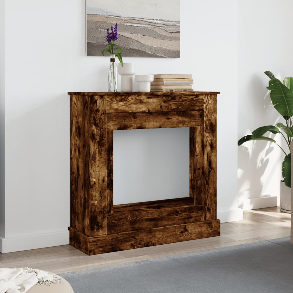 The fireplace surround placed against a white wall in a modern living room setting