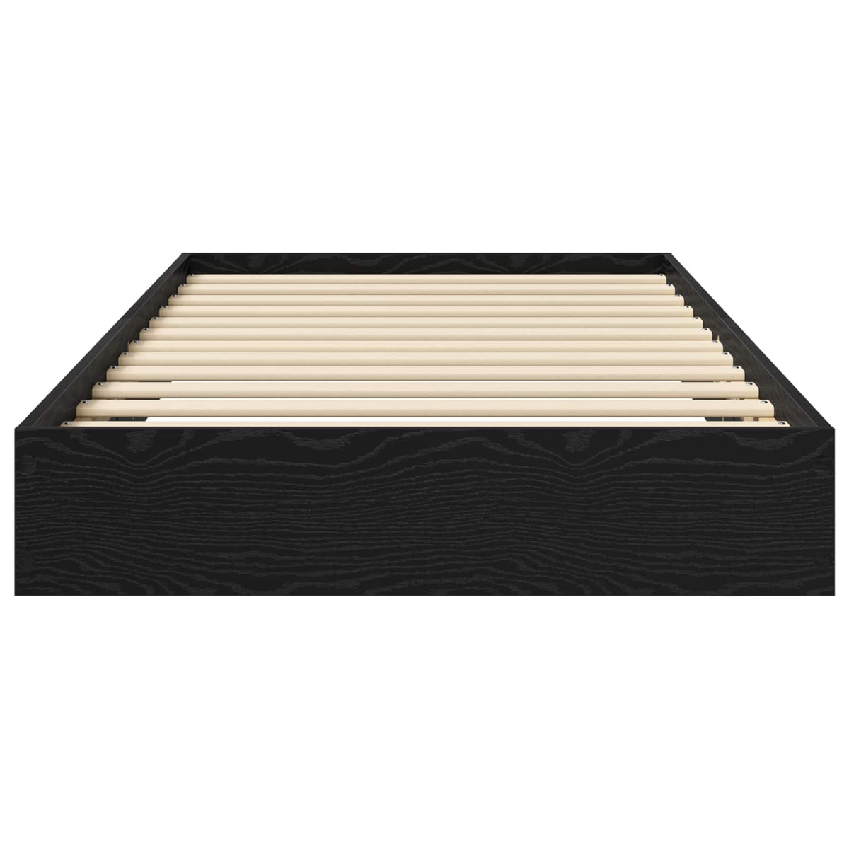 The floor bed frame viewed from the foot end showing the wooden slats and black frame edges