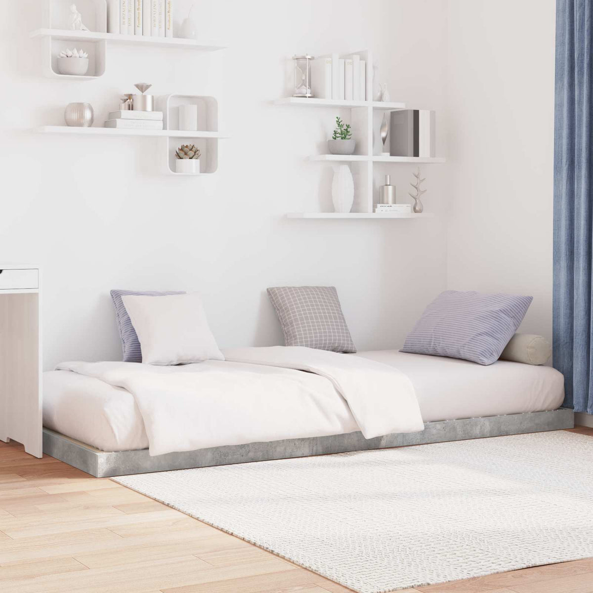 Two concrete grey floor bed frames placed together in a room