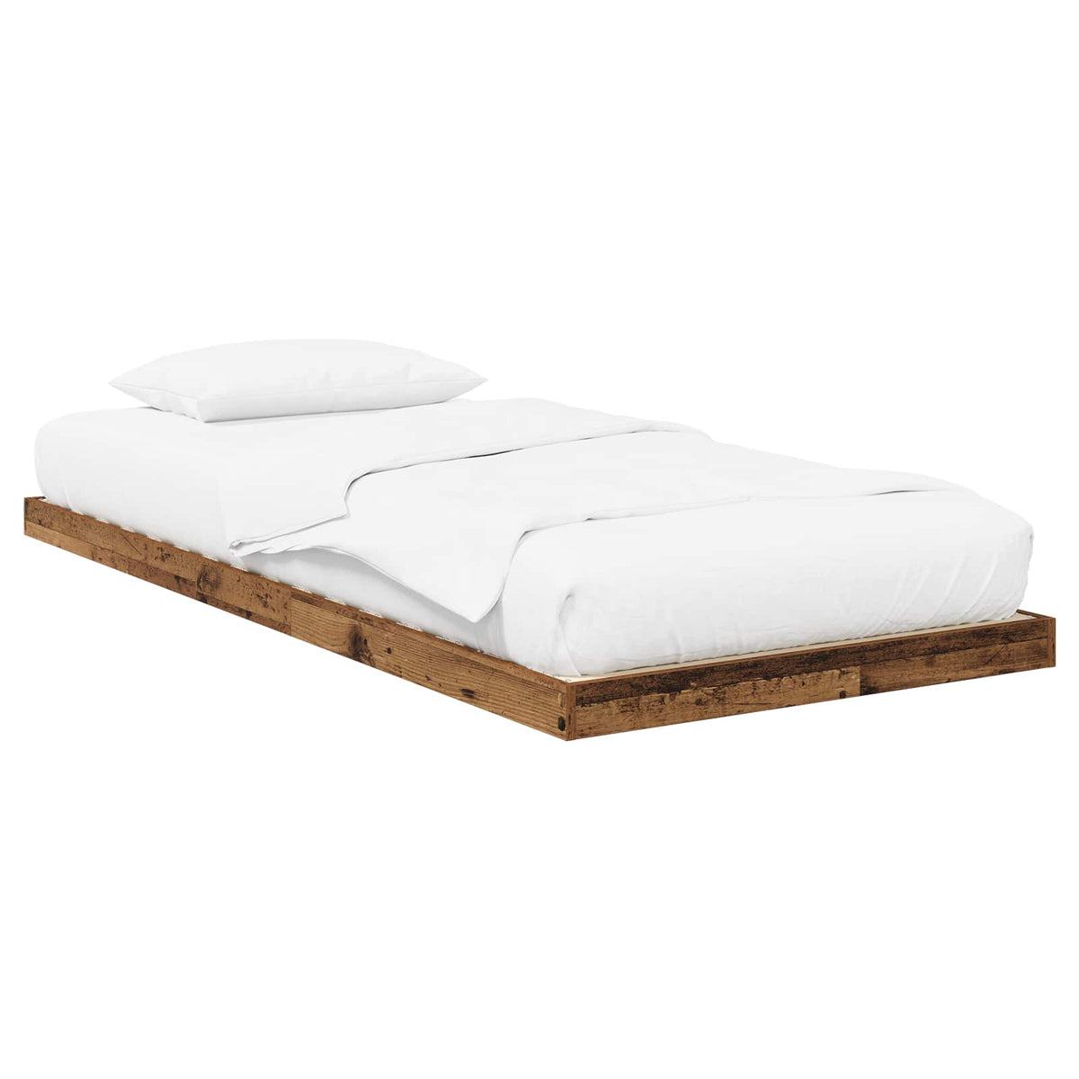 the floor bed frame with a mattress and white bedding against a plain white background