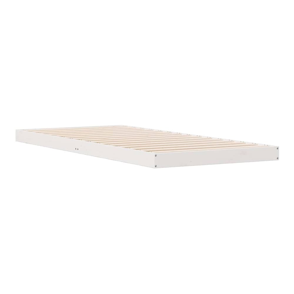 The white floor bed frame, viewed from the side, showing the wooden slats