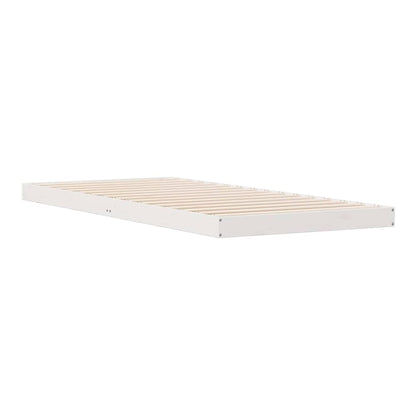 The white floor bed frame, viewed from the side, showing the wooden slats