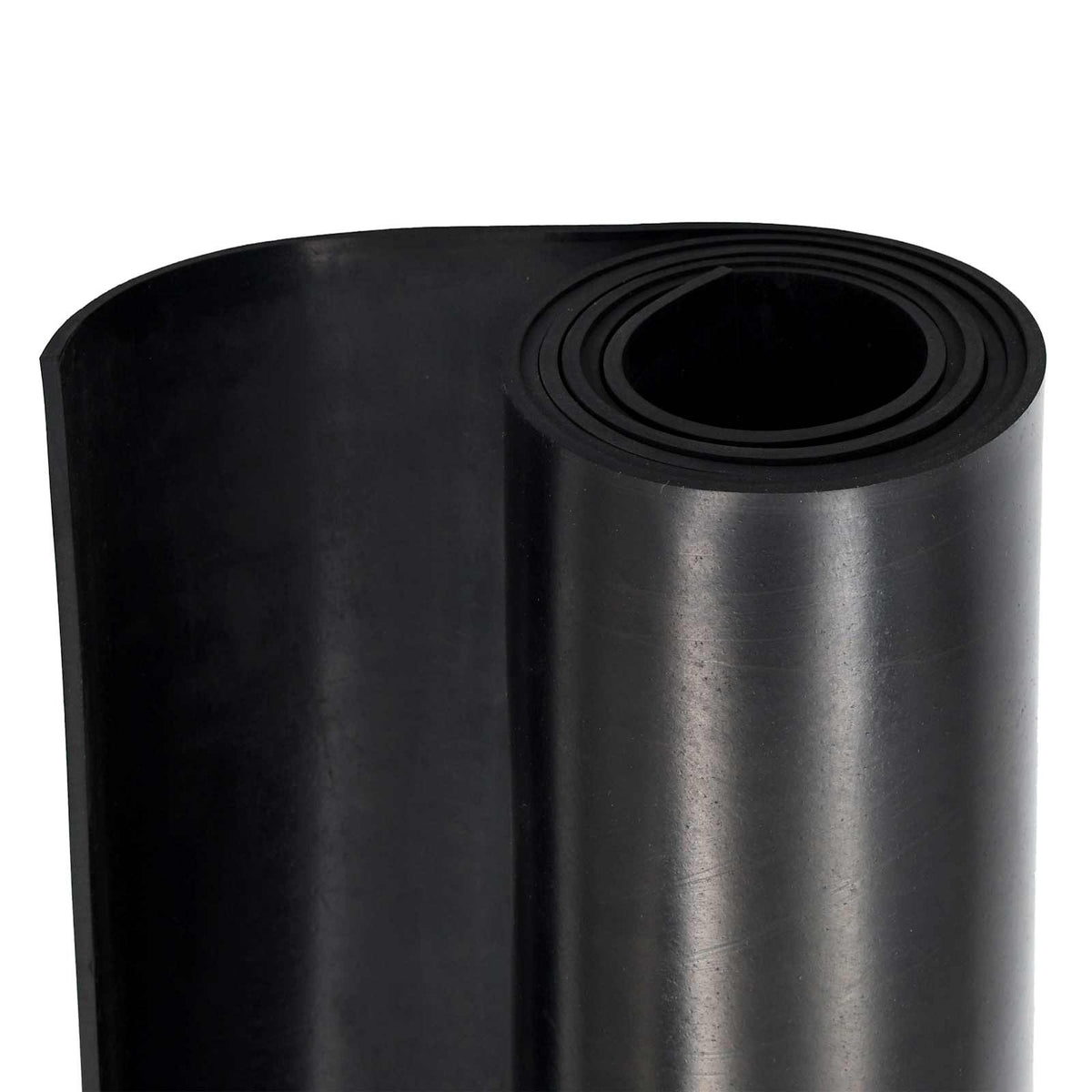 The edge of a rolled black rubber floor mat showing its thickness