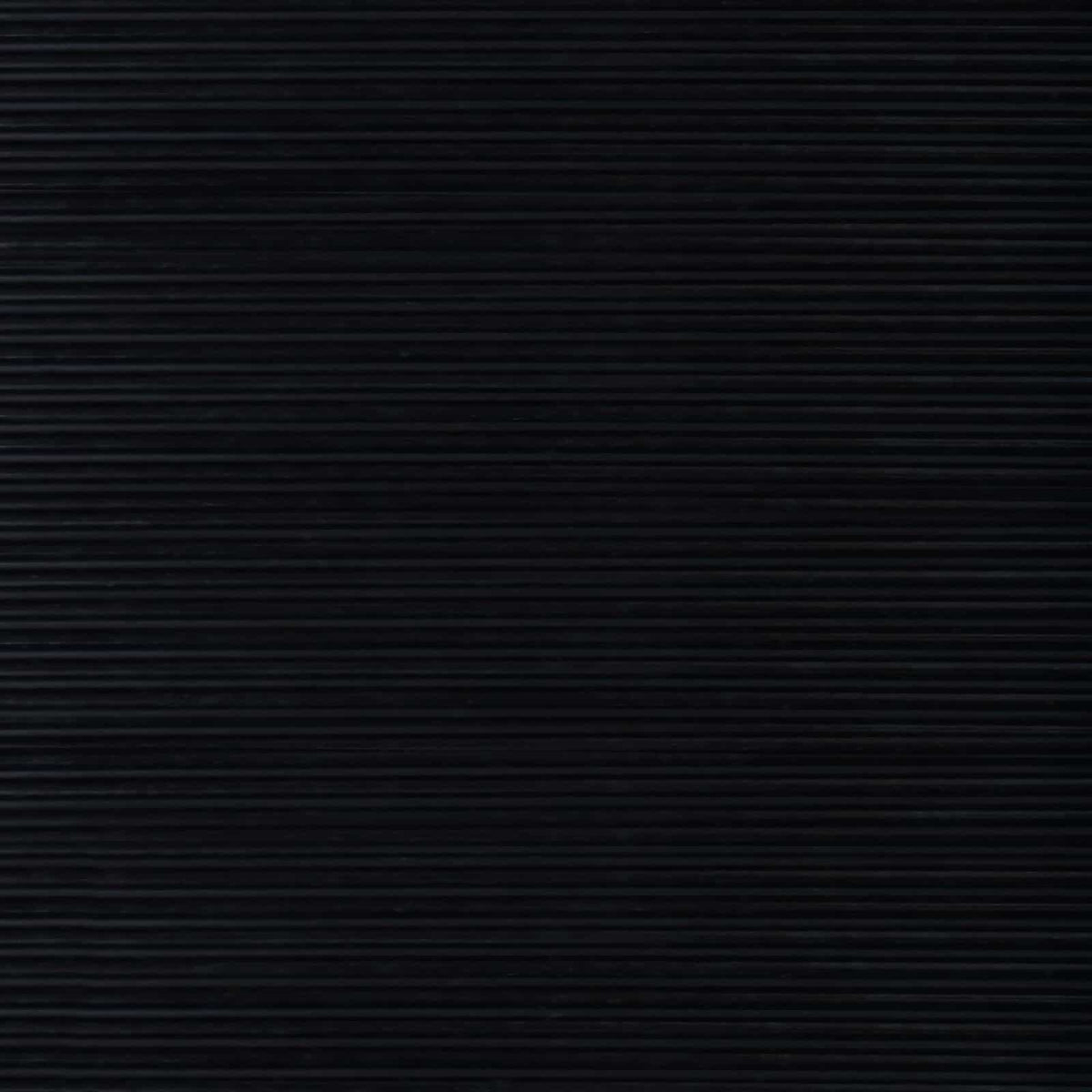 A detailed close-up of the black rubber floor mat's ribbed surface