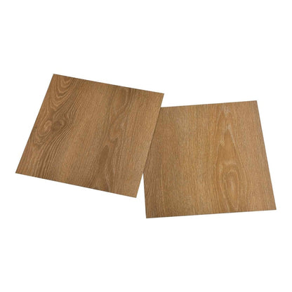 Two brown wood effect PVC flooring planks angled on a white background