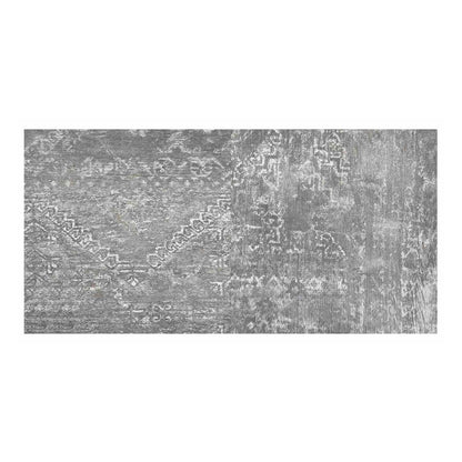 A rectangular arrangement of grey concrete effect vinyl flooring planks with a distressed pattern