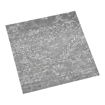 Close up of a single grey concrete effect vinyl flooring plank with a distressed pattern