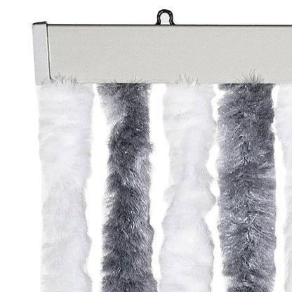 Close up of the top of the fly curtain showing the hanging mechanism and fluffy strands