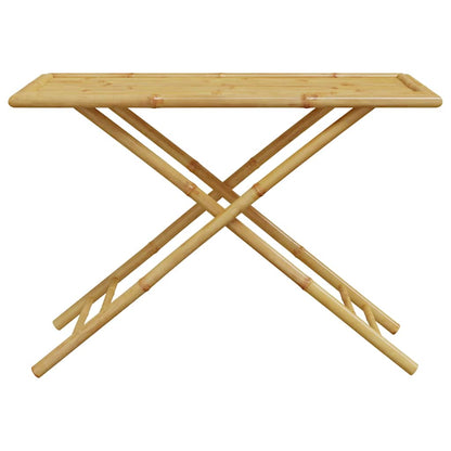 A close-up of the bamboo garden table's slatted top and X-shaped legs
