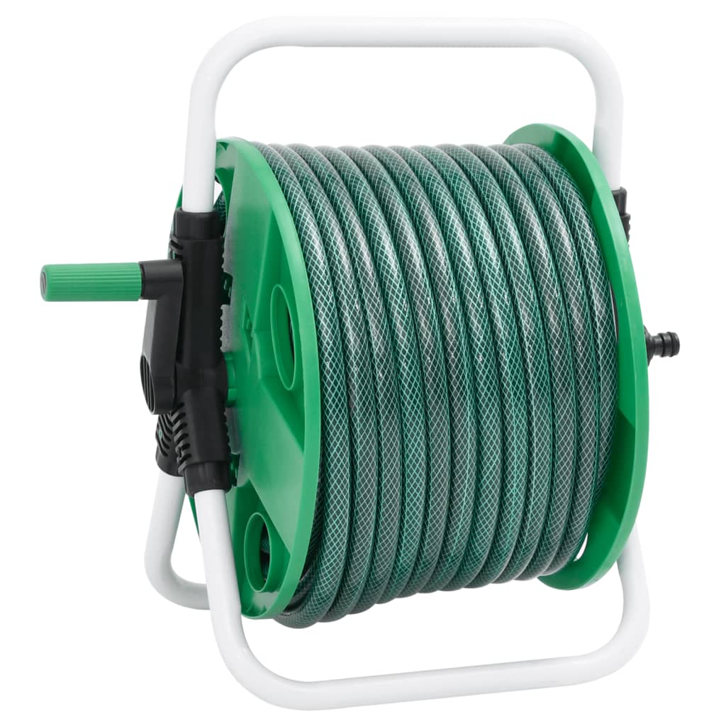 The free standing green hose reel with its white frame and coiled green hose, viewed from a slight angle