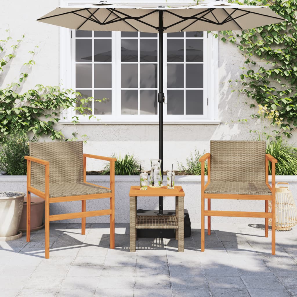 Two garden chairs with a small table and umbrella in an outdoor setting