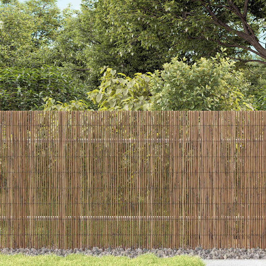 vidaXL Garden Fence Natural a natural bamboo garden fence in a garden setting