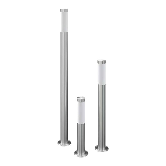 Three stainless steel garden lamps of varying heights standing upright