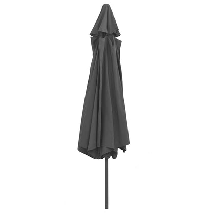 The grey garden parasol is closed and tied, with its canopy folded around the metal pole