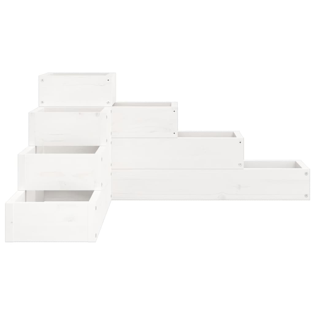 The white tiered planter, showing the stepped structure from a low angle