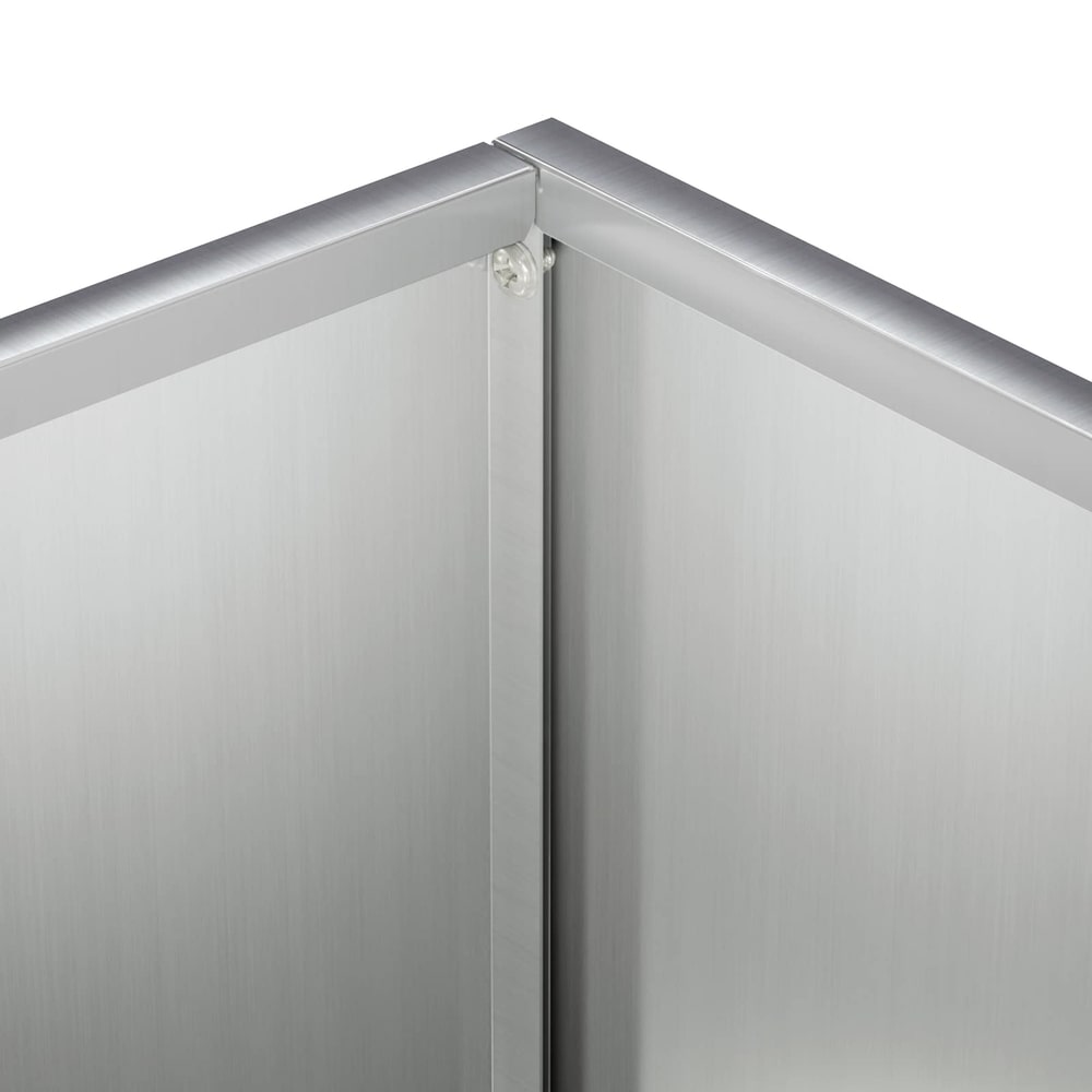 A close-up of the metal garden planter corner showing the internal frame and screw