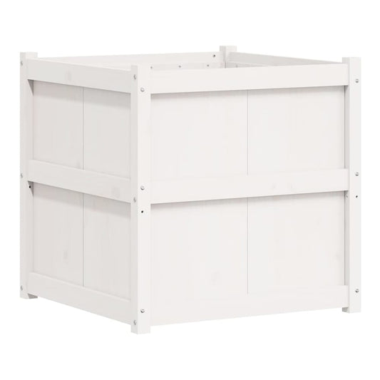 the white wooden planter shown from a low angle with plants inside
