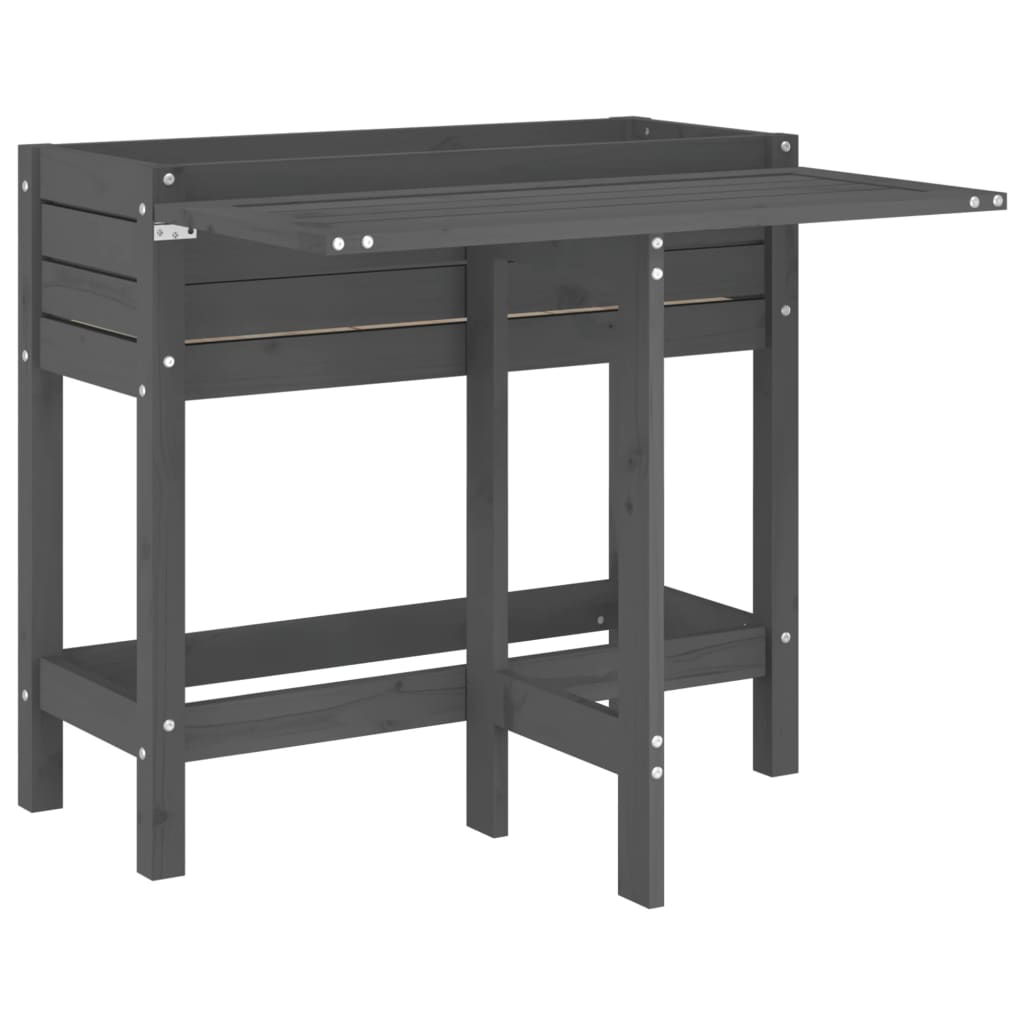 A grey wooden garden planter with a fold-out table, shown with the table folded down