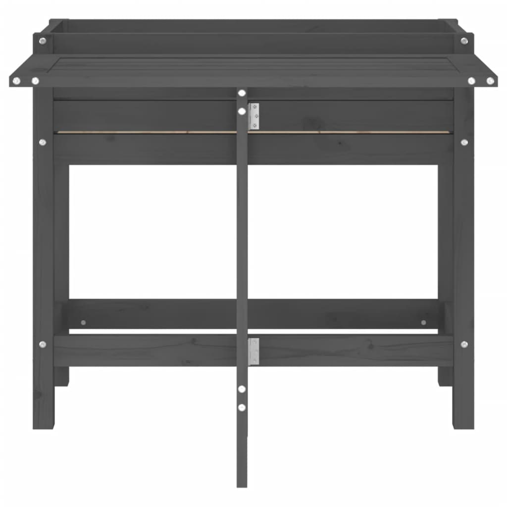 The back of a grey wooden garden planter with a fold-out table, showing the construction