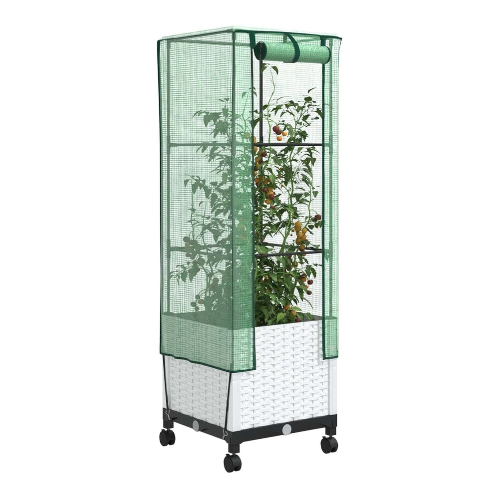 White planter with a green cover and plants inside, viewed from the side