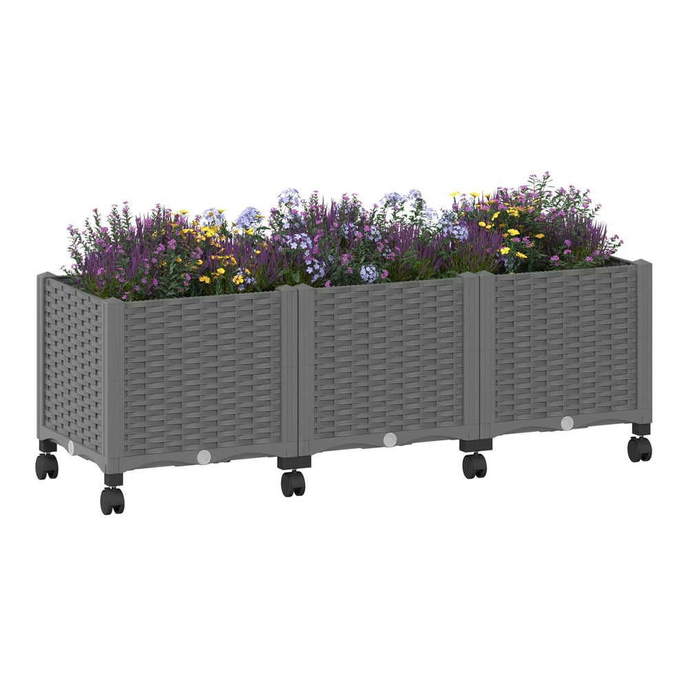 A light grey garden planter with wheels filled with purple and yellow flowers