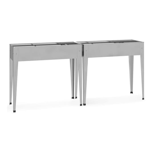 Two galvanised steel planters side by side on a white background