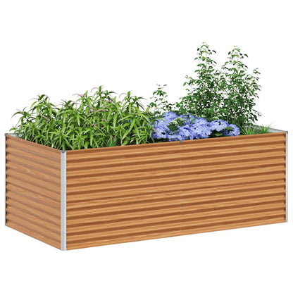 The galvanised raised garden bed filled with green plants and some purple flowers