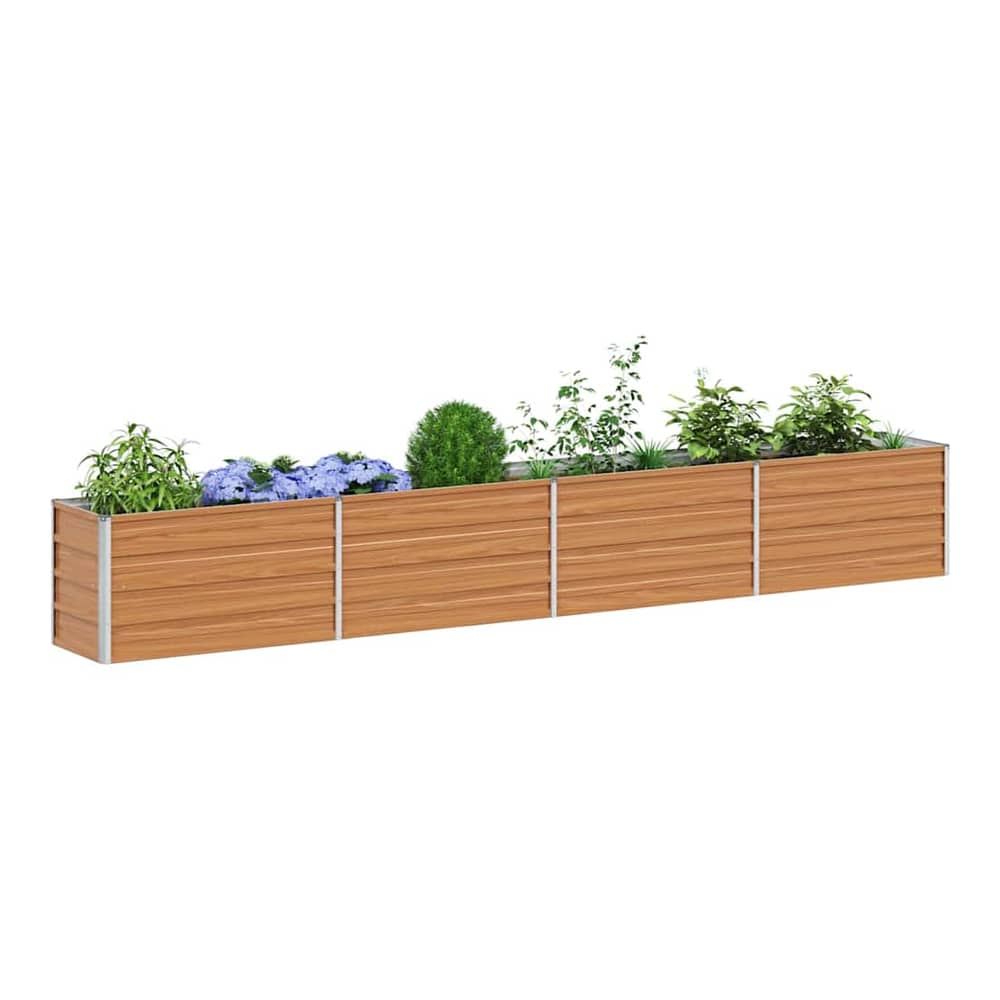 The galvanised raised garden bed filled with various plants and flowers