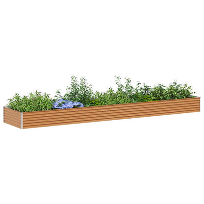 The light brown galvanised raised garden bed filled with green plants