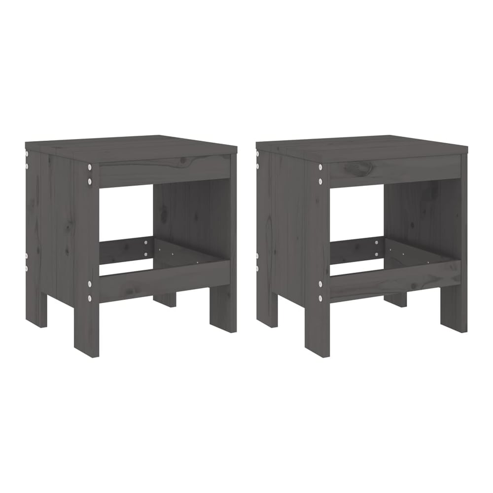 Two grey solid wood pine garden stools side by side on a wooden floor