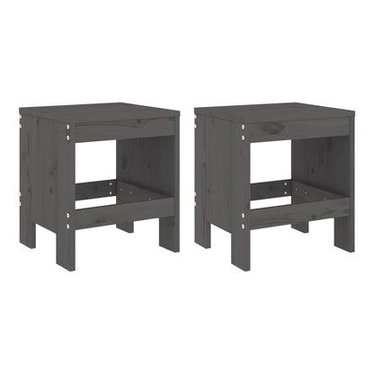 Two grey solid wood pine garden stools side by side on a wooden floor
