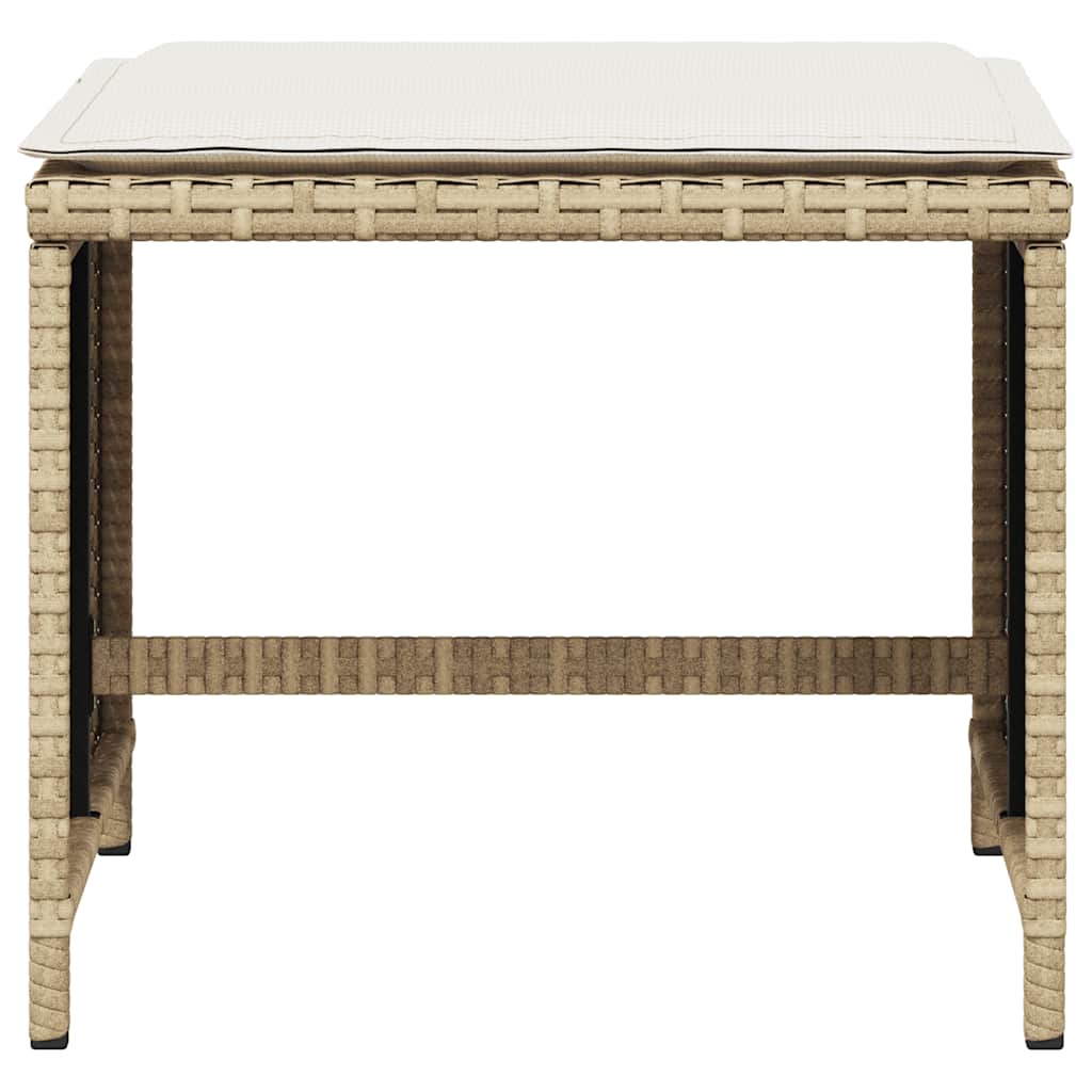 Front view of a beige poly rattan garden stool with a cushion on top