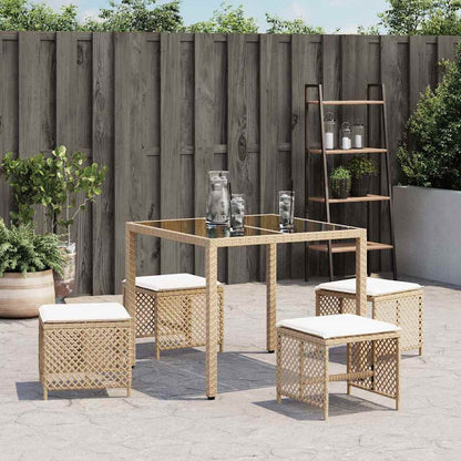 Garden Stools with Cushions 4 pcs Beige Poly Rattan, the outdoor foot rests tucked under a square glass table on a patio