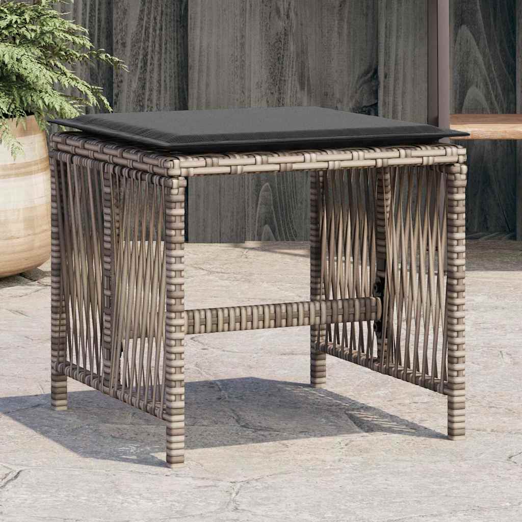 vidaXL Garden Stools with Cushions 4 pcs Grey Poly Rattan, a single stool with a grey cushion on top, set on paving stones