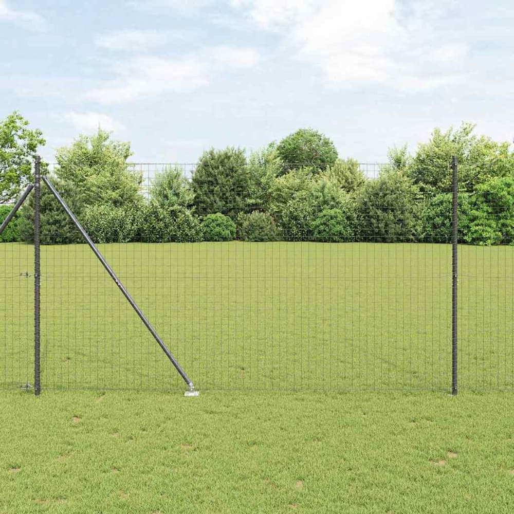 vidaXL Ground Spike Fence Post 7 pcs Grey Powder-Coated Steel installed in a grassy area with a wire fence