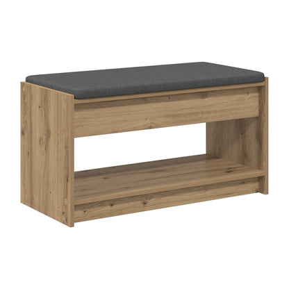 storage bench with a grey upholstered seat and two open shelves below, in an artisan oak finish