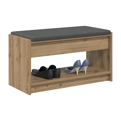 storage bench with a grey upholstered seat and two open shelves, holding shoes