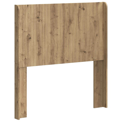 The artisan oak headboard with a ribbed texture and wooden posts