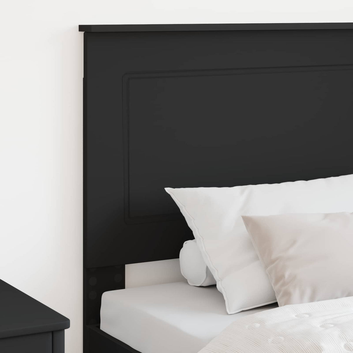 Close-up of the black oak headboard showing the texture and design
